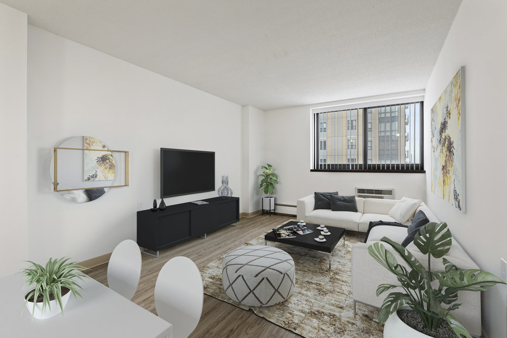 Modern living room with a large window, white sofa, TV, plants, and abstract decor in neutral tones.