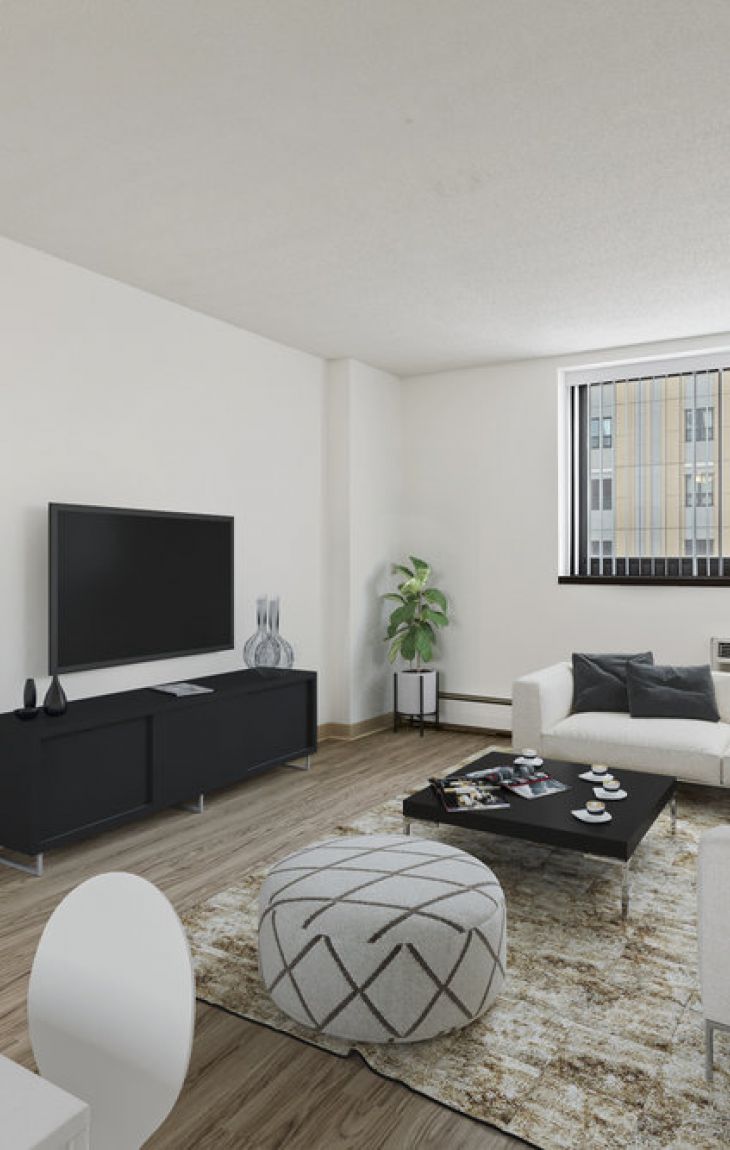 Modern living room with a large window, white sofa, TV, plants, and abstract decor in neutral tones.